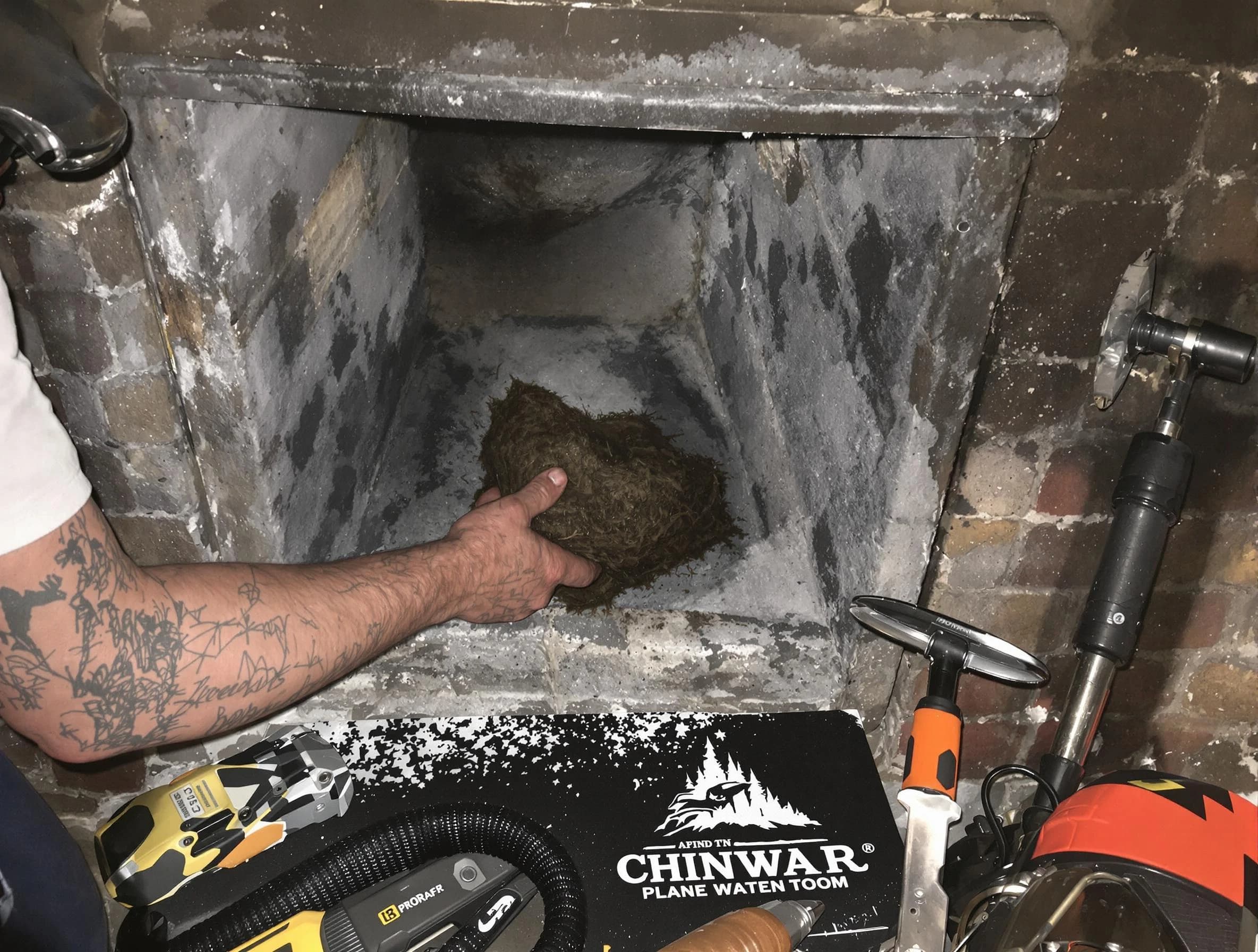 Irondale Chimney Sweep safely removing debris and screening chimney in Irondale, GA
